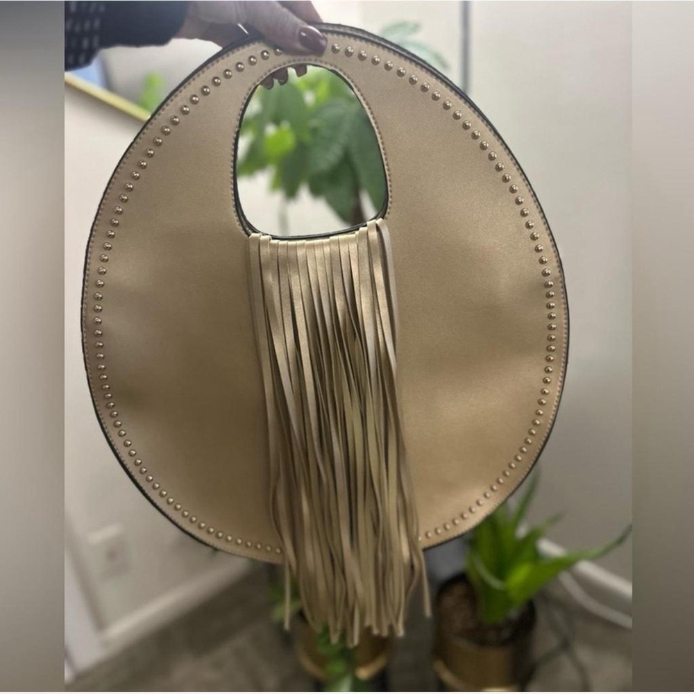 Light Gold Round Satchel with Gold Studs and Fringe Accents and Shoulder Strap